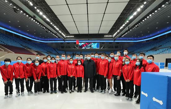 Chinese President Xi Jinping, also general secretary of the Communist Party of China Central Committee and chairman of the Central Military Commission, poses for a group photo with athletes and coaches while visiting the Capital Gymnasium in Haidian District, Beijing, capital of China, Jan. 18, 2021. Xi on Monday inspected the preparatory work of the Beijing 2022 Olympic and Paralympic Winter Games in Beijing. (Xinhua/Ju Peng)