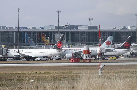 Two Air Canada Boeing 737 Max 8 aircraft (Left and Right) are seen at Vancouver International Airport in Richmond, Vancouver, Canada, March 13, 2019. (Xinhua/Liang Sen)