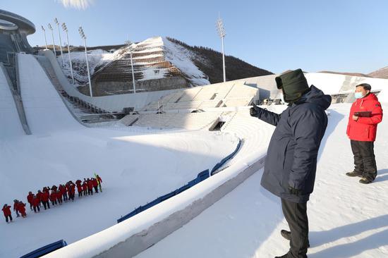 President Xi Jinping extends greetings to athletes and coaches at the National Ski Jumping Center in Zhangjiakou, north China's Hebei Province, Jan. 19, 2021. (Xinhua/Wang Ye)
