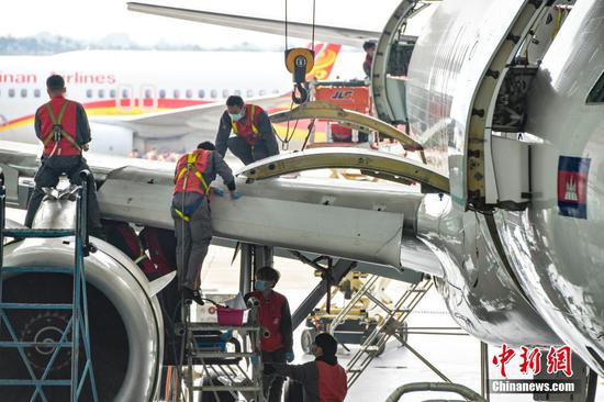 An Airbus A320 of Cambodian Lanmei Airlines is under maintenance at Haikou Meilan International Airport in South China's Hainan Province, Jan. 19, 2021. (Photo/China News Service)