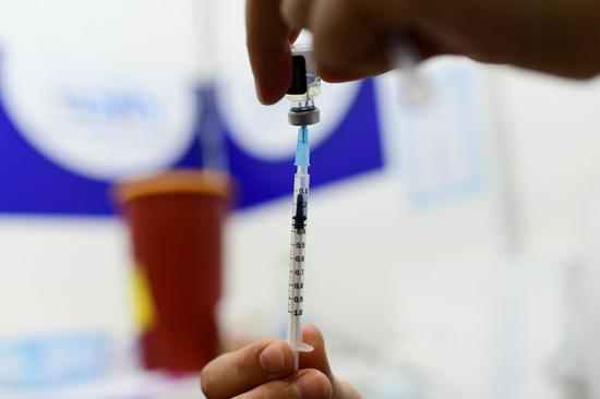 A medical worker prepares the COVID-19 vaccine at a health service center in Tel Aviv, Israel, on Feb. 4, 2021. The number of people vaccinated against the COVID-19 in Israel has surpassed 3.34 million, or 35.9 percent of the total population, since the vaccination campaign began on Dec. 20, 2020. (Tomer Neuberg/JINI via Xinhua)