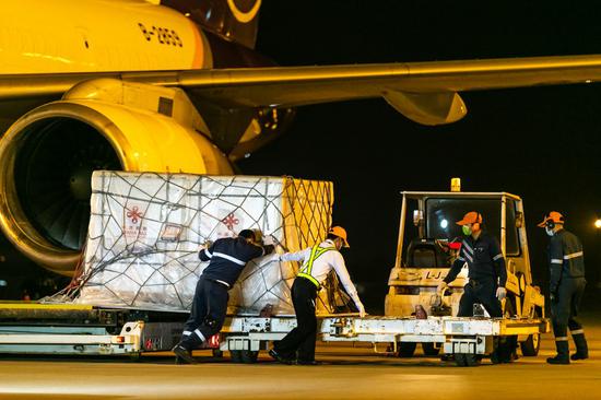 A batch of China-donated Sinopharm COVID-19 vaccines arrived in the Lao capital Vientiane early on February 8, 2021. (Kaikeo Saiyasane/Xinhua)