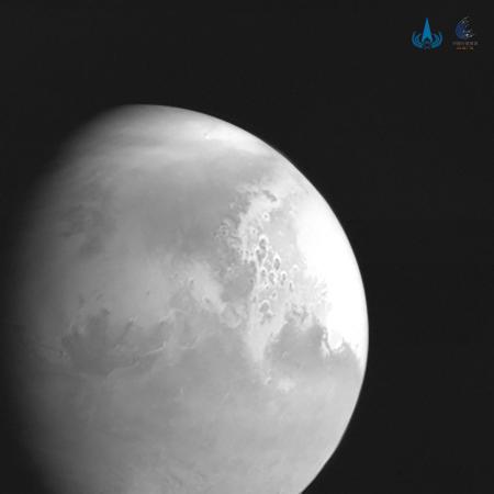A black-and-white picture of Mars taken by Tianwen 1, the first snapshot from the Chinese craft. [Photo provided by China National Space Administration]