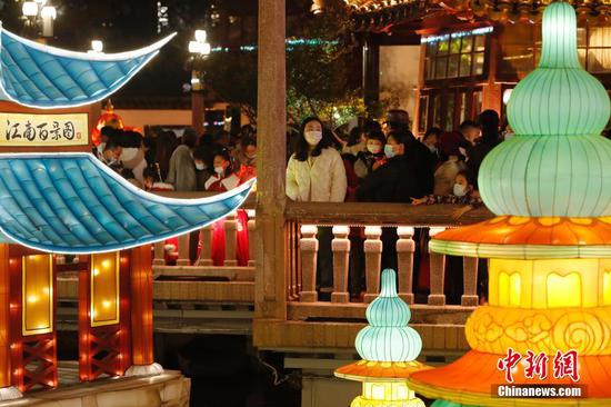 Visitors view lanterns at Yuyuan Garden in Shanghai
