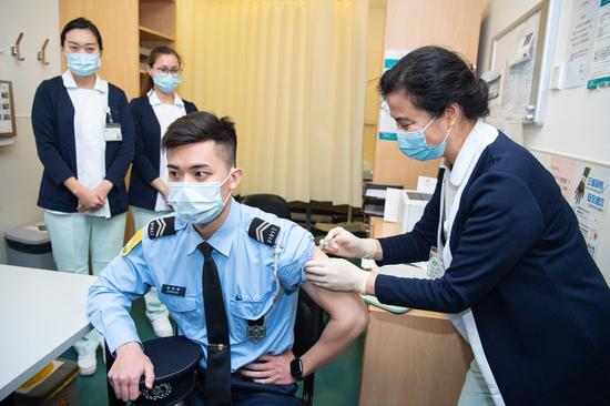 A member of the Macao Special Administrative Region (SAR) disciplined forces receives the COVID-19 vaccine in Macao, south China, Feb. 9, 2021. (Xinhua/Cheong Kam Ka)