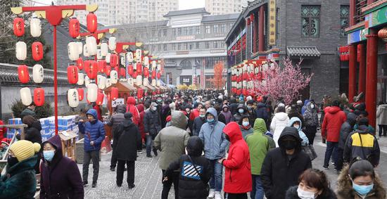 People visit the Old North Market during the Lunar New Year holiday in Shenyang, northeast China's Liaoning Province, Feb. 14, 2021. (Xinhua/Yang Qing)