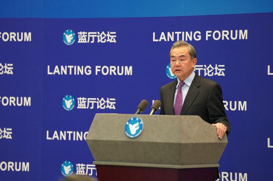 Chinese State Councilor and Foreign Minister Wang Yi delivers a speech at the opening of the Lanting Forum with the theme of 