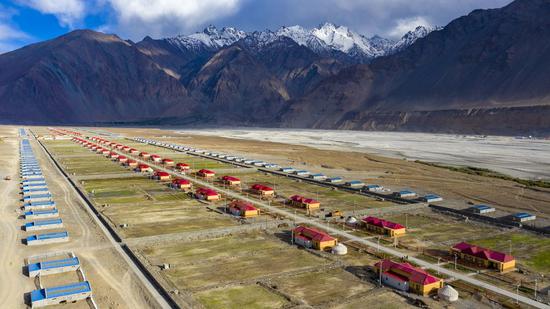 Aerial photo taken on June 6, 2020 shows a resettlement community for relocated residents of Rasekam Village in Taxkorgan Tajik Autonomous County, northwest China's Xinjiang Uygur Autonomous Region. (Xinhua/Hu Huhu)