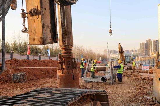 Employees work at the construction site of the first phase of the subway Line 8 in Hefei, east China's Anhui Province, Feb. 21, 2021. (Xinhua/Cao Li)