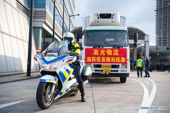The truck carrying the second batch of mainland-made COVID-19 vaccines arrives at the Zhuhai-Macao Cross-Border Industrial Zone, Feb. 28, 2021. The second batch of mainland-made COVID-19 vaccines were delivered to the Macao Special Administrative Region on Sunday. The first batch of mainland-made vaccines were delivered to Macao on Feb. 6. Inoculation started on Feb. 9. (Xinhua/Cheong Kam Ka)