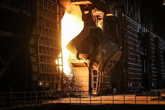 A worker checks on a furnace at a plant of Ansteel Group Co., Ltd. in Anshan, northeast China's Liaoning Province, July 5, 2019. (Xinhua/Pan Yulong)