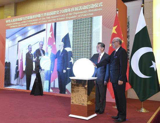 Chinese State Councilor and Foreign Minister Wang Yi attends a virtual ceremony with Pakistani Foreign Minister Shah Mahmood Qureshi to formally commence the celebrations of the 70th anniversary of diplomatic relations between the two countries in Beijing, China, March 2, 2021. (Xinhua/Rao Aimin)