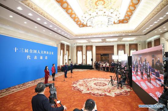 NPC deputies receive interview before opening meeting of fourth session of 13th NPC