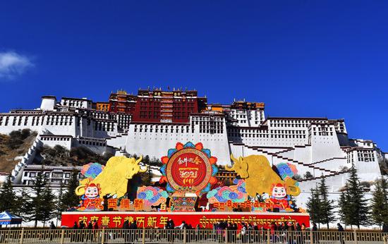 Decorations for the Spring Festival and the Tibetan New Year are seen in front of the Potala Palace in Lhasa, capital of southwest China's Tibet Autonomous Region, Feb. 8, 2021. (Xinhua/Chogo)