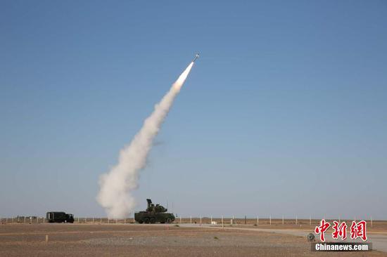 A HQ-17AE air-defense missile is fired during a recent test. (Photo/China News Service)