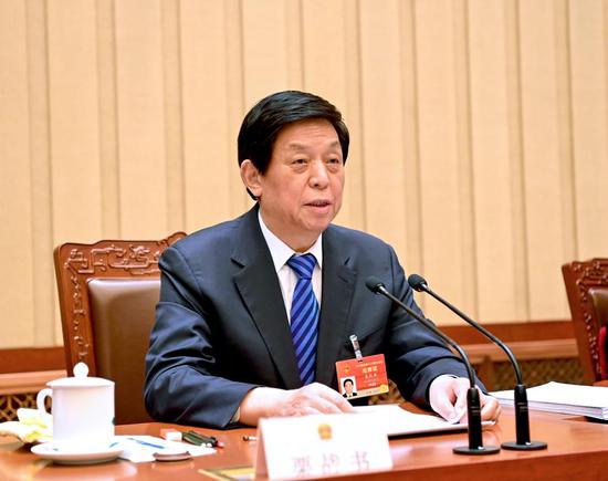 Li Zhanshu, an executive chairman of the presidium of the fourth session of the 13th National People's Congress (NPC), presides over the second meeting of the presidium at the Great Hall of the People in Beijing, capital of China, March 9, 2021. (Xinhua/Li Xueren)