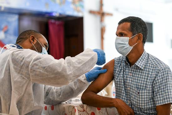 A man receives a dose of a vaccine against the coronavirus disease at St. Paul's Church in Abu Dhabi, United Arab Emirates on Jan 16, 2021. (Photo/Agencies)