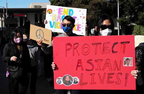 People take part in a rally against anti-Asian hate crimes in San Mateo, California, the United States, on Feb. 27, 2021. (Xinhua/Wu Xiaoling)