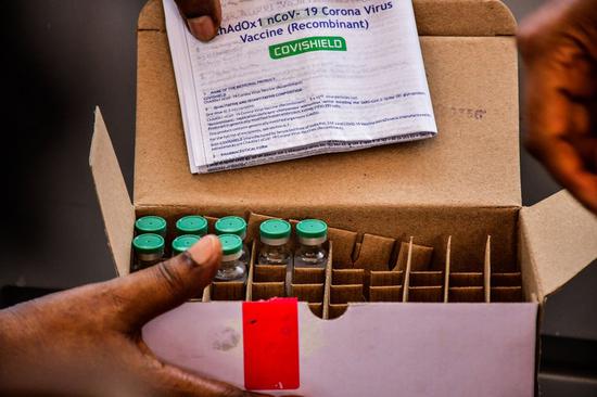 Doses of AstraZeneca COVID-19 vaccine are displayed during the launch of the COVID-19 vaccination campaign at Mulago Specialized Women and Neonatal Hospital in Kampala, Uganda, March 10, 2021. (Photo by Joseph Kiggundu/Xinhua)