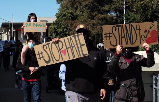 People take part in a rally against anti-Asian hate crimes in San Mateo, California, the United States, on Feb. 27, 2021. (Xinhua/Wu Xiaoling)