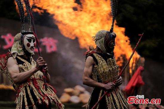 Ethnic Yi people perform traditional Nuo ritual