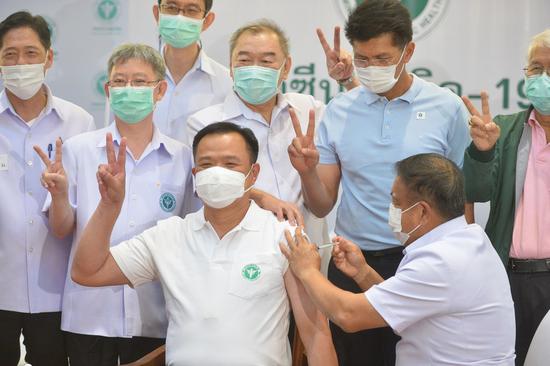 Thai Deputy Prime Minister and Public Health Minister Anutin Charnvirakul (L, Front) receives his second shot of the COVID-19 vaccine developed by China's Sinovac in Bangkok, Thailand, on March 23, 2021. (Xinhua/Rachen Sageamsak)