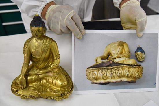 Photo taken on March 19, 2021 shows a restored gold-plated bronze buddha statue from the Qing Dynasty in northwest China's Xinjiang Uygur Autonomous Region. (Xinhua/Ding Lei)