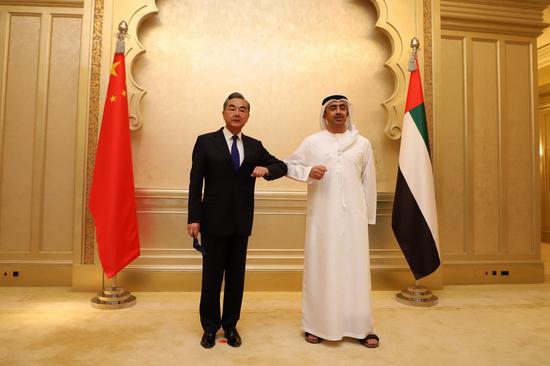 Visiting Chinese State Councilor and Foreign Minister Wang Yi (L) meets with his counterpart of the United Arab Emirates Sheikh Abdullah bin Zayed al-Nahyan in Abu Dhabi, the United Arab Emirates, on March 28, 2021. (Xinhua)