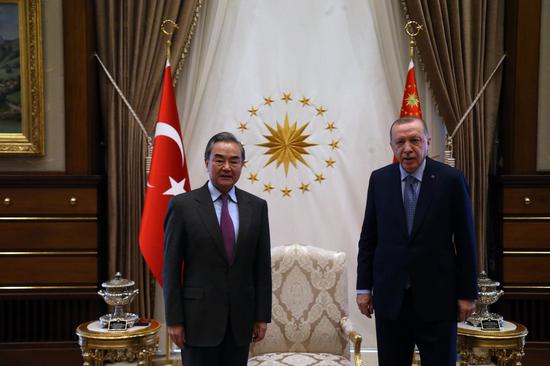 Turkish President Recep Tayyip Erdogan (R) meets with visiting Chinese State Councilor and Foreign Minister Wang Yi in Ankara, Turkey, on March 25, 2021. (Photo by Mustafa Kaya/Xinhua)