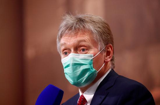 Kremlin spokesman Dmitry Peskov wearing a protective face mask attends Russian President Vladimir Putin's annual end-of-year news conference, held online in a video conference mode, in Moscow, Russia, Dec 17, 2020. (Photo/Agencies)
