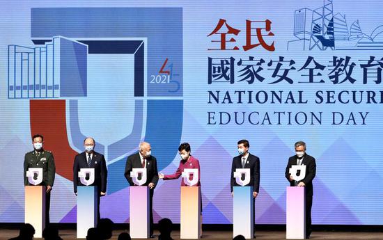 Chief Executive Carrie Lam Cheng Yuet-ngor (fourth left) leads in officiating in the opening ceremony of the 