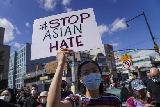 People attend a rally against racism and violence on Asian Americans in Flushing of New York, the United States, March 27, 2021. (Xinhua/Wang Ying)