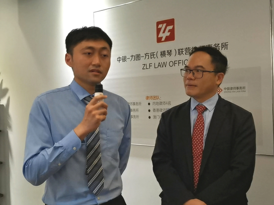 Cheung Sze-yuen (left), a Macao resident and an apprentice lawyer at Zhuhai-based ZLF Law Office. (Xinhua/Xu Hongyi)