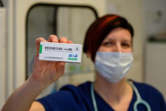 A family doctor shows a box of the Sinopharm COVID-19 vaccine in Varoslod, Hungary on Feb. 24, 2021.  (Tamas Vasvari/MTI via Xinhua)