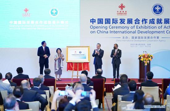 Chinese State Councilor and Foreign Minister Wang Yi attends the opening ceremony of Exhibition of Achievements on China International Development Cooperation and delivers a speech in Beijing, capital of China, April 26, 2021. (Xinhua/Li Xiang)