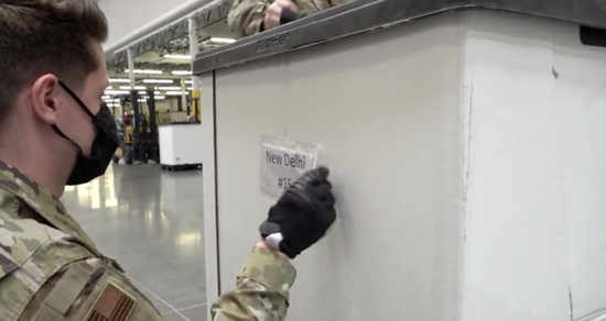 Video screenshot posted on April 26, 2021 shows soldiers pack up medical supplies to deliver to India at a warehouse in California, the United States. (Credit: Office of Governor Gavin Newsom)