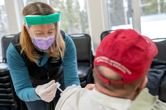 Nurse Practitioner Kim Sonderland administers a Moderna (COVID-19) vaccine to a tribal resident of Eagle, Alaska, U.S., March 31, 2021. (Photo/Agencies)