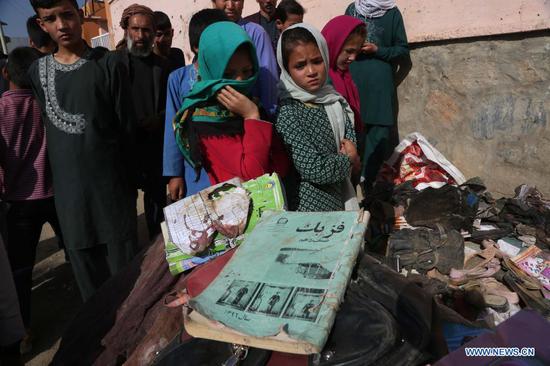 Photo taken on May 9, 2021 shows the books of students who were killed in a car bomb attack in Kabul, capital of Afghanistan. (Photo by Rahmatullah Alizadah/Xinhua)