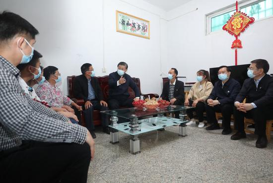 Chinese President Xi Jinping, also general secretary of the Communist Party of China Central Committee and chairman of the Central Military Commission, learns about the resettlement of people relocated because of the South-to-North Water Diversion Project, and measures to develop specialty industries and boost the incomes of resettled residents in Zouzhuang Village, Xichuan County, Nanyang, central China's Henan Province, May 13, 2021. (Xinhua/Wang Ye)