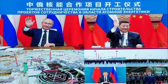 Chinese President Xi Jinping and his Russian counterpart Vladimir Putin witness the ground-breaking ceremony of a bilateral nuclear energy cooperation project, Tianwan nuclear power plant and Xudapu nuclear power plant, via video link in Beijing, capital of China, May 19, 2021. (Xinhua/Yue Yuewei)