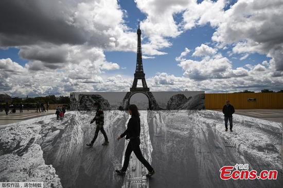 Optical illusion leaves Eiffel Tower teetering over ravine