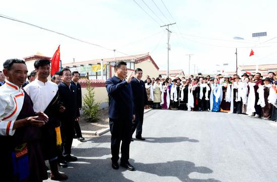 Chinese President Xi Jinping, also general secretary of the Communist Party of China Central Committee and chairman of the Central Military Commission, talks to local Tibetan residents while visiting a village of Shaliuhe Township in Gangcha County of Haibei Tibetan Autonomous Prefecture, northwest China's Qinghai Province, June 8, 2021. Xi on Tuesday visited Gangcha County during his inspection tour of Qinghai Province. (Xinhua/Li Xueren)