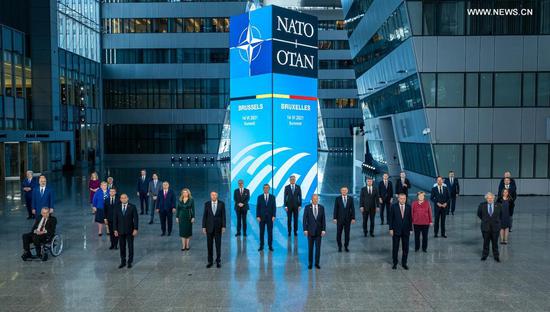 NATO leaders pose for a group photo during a summit at the organization's headquarters in Brussels on Monday. (Photo/Xinhua)
