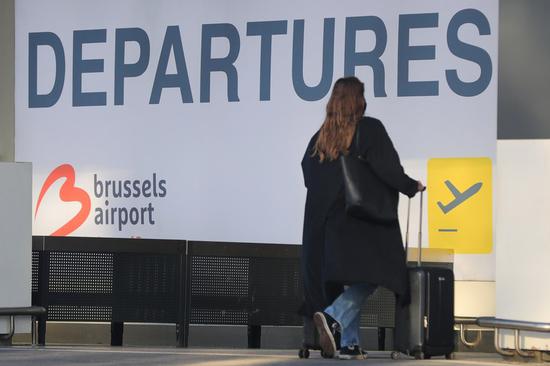 A woman walks to the departure hall at the Brussels Airport in Zaventem, Belgium, April 19, 2021. (Xinhua/Zheng Huansong)