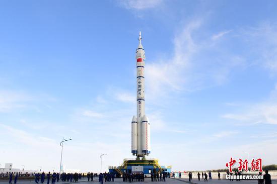 The Long March 2F carrier rocket carrying the Shenzhou XII spacecraft is moved to its launch pad at the Jiuquan Satellite Launch Center in northwestern China's Gobi Desert. (China News Service/Wang Jiangbo)