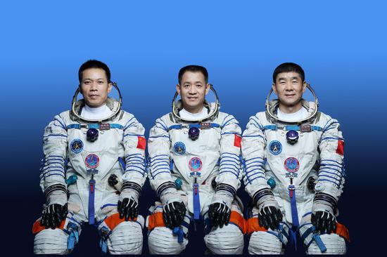 Chinese astronauts Nie Haisheng (C), Liu Boming (R) and Tang Hongbo will carry out the Shenzhou-12 manned spaceflight mission. (Photo by Xu Bu/Xinhua)