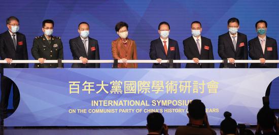 Officials attend the opening ceremony of the International Symposium On The Communist Party of China's History of 100 Years in Wan Chai, Hong Kong, on Wednesday. CALVIN NG/CHINA DAILY