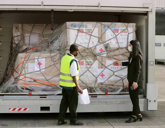 A staff worker checks a shipment of COVID-19 vaccines donated by the Red Cross Society of China in Addis Ababa, Ethiopia, on Saturday. (Photo/Xinhua)