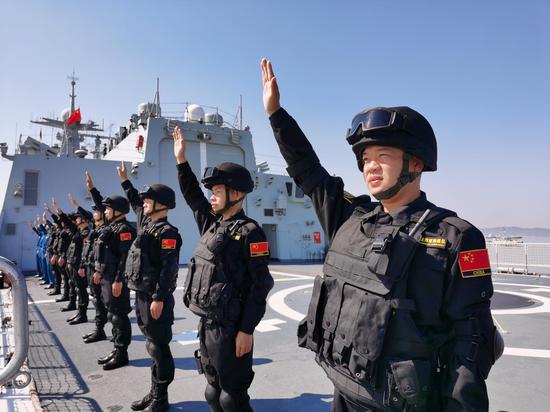 Special operation soldiers of the Chinese naval fleet for escort mission wave farewell on the deck at a port in Zhoushan, east China's Zhejiang Province, April 28, 2020. (Xinhua/Jiang Shan)