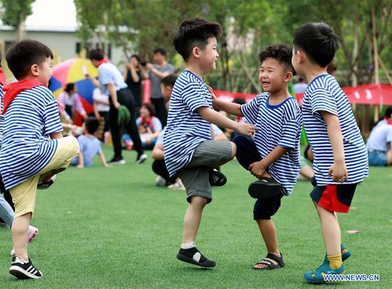 Children play games at a kindergarten in Renxian County of Xingtai City, north China's Hebei Province, June 1, 2019. Various activities are held across the county to celebrate the International Children's Day, which falls on Saturday. (Xinhua/Song Jie)